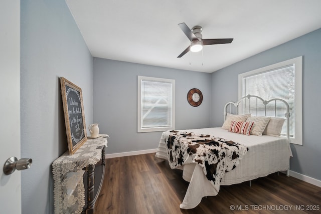 bedroom featuring dark hardwood / wood-style floors and ceiling fan