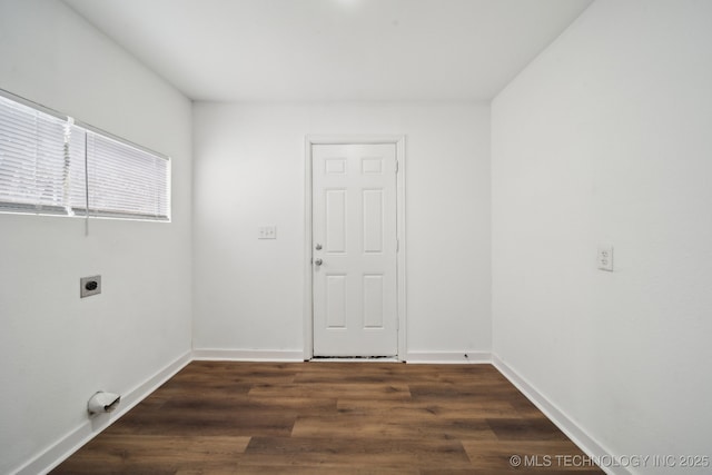 spare room with dark hardwood / wood-style floors