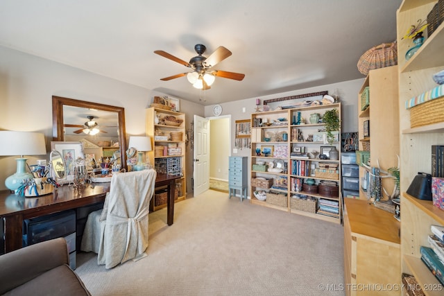 carpeted office featuring ceiling fan