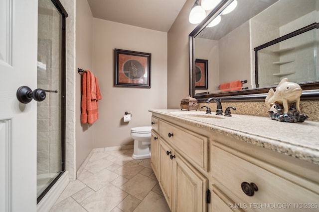 bathroom featuring vanity, toilet, and a shower with shower door