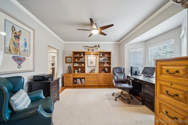 office space with crown molding, light wood-type flooring, and ceiling fan