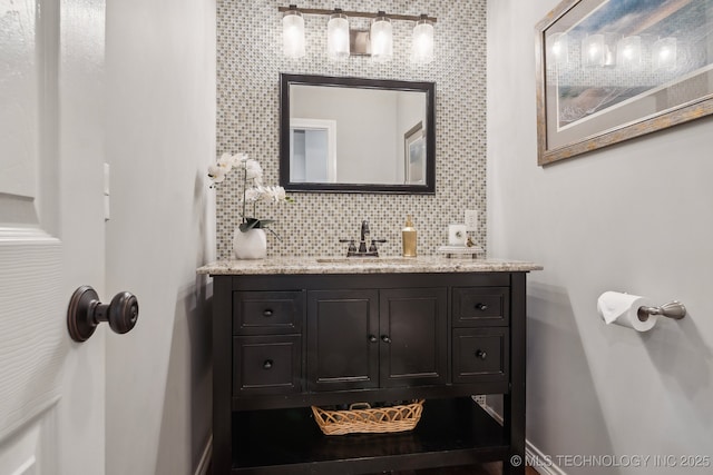 bathroom with vanity and decorative backsplash