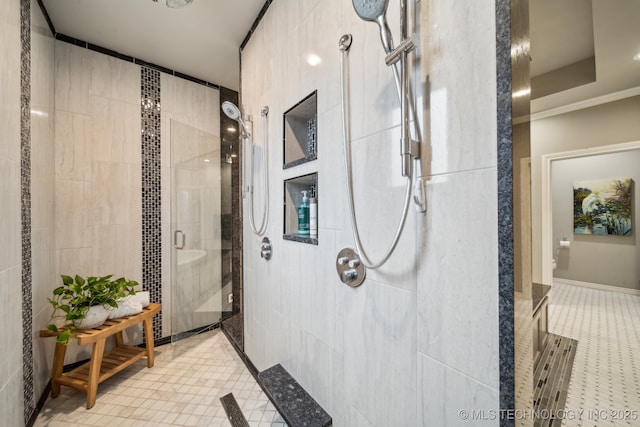 bathroom featuring a shower with door, ornamental molding, and tile patterned floors