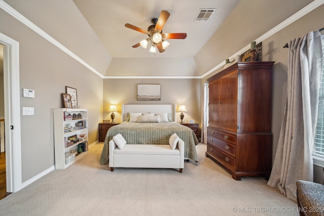 bedroom with ceiling fan, a tray ceiling, and light carpet