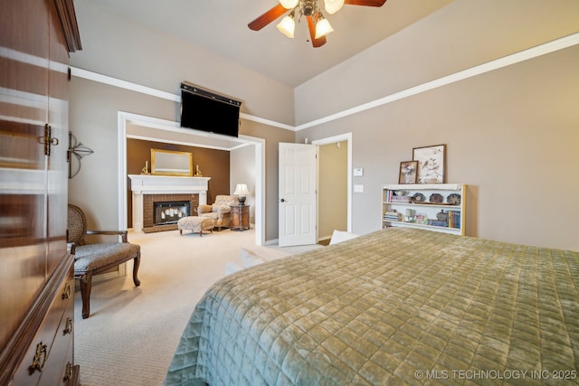 carpeted bedroom featuring ceiling fan, lofted ceiling, and a brick fireplace