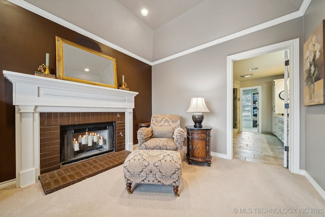 sitting room featuring a fireplace and light carpet