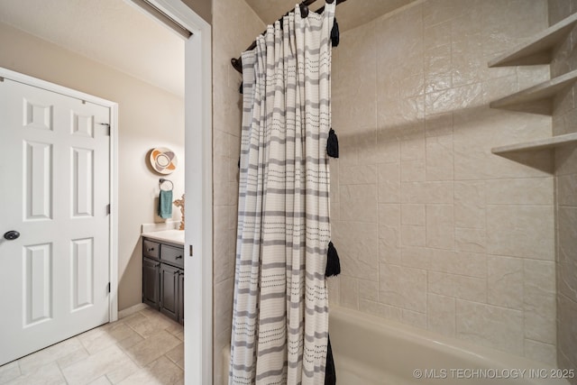 bathroom featuring vanity and shower / bathtub combination with curtain