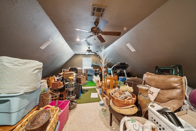 additional living space with lofted ceiling, ceiling fan, a textured ceiling, and carpet flooring