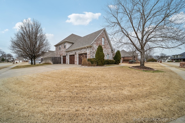 view of home's exterior featuring a garage and a lawn