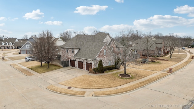 view of front of house with a garage and a front yard