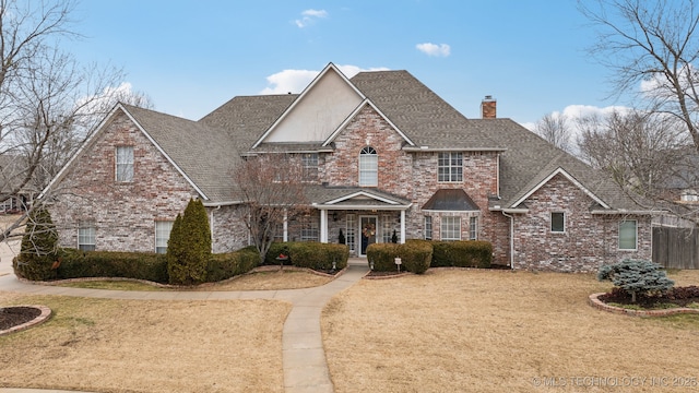 front facade with a front lawn