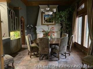 dining area featuring plenty of natural light and a chandelier