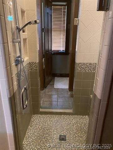 bathroom featuring tile patterned floors and walk in shower