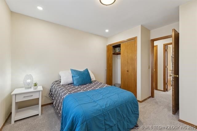 carpeted bedroom featuring a closet