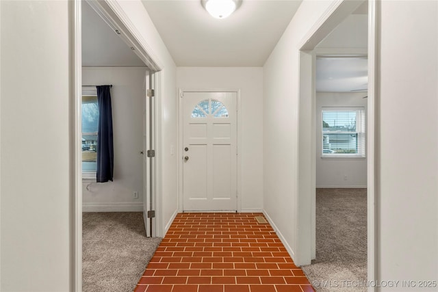 entryway with carpet floors