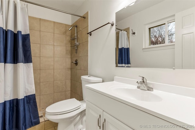 bathroom featuring vanity, tile patterned floors, toilet, and walk in shower