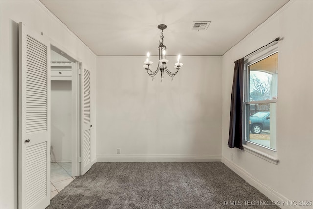 unfurnished dining area with an inviting chandelier and light carpet