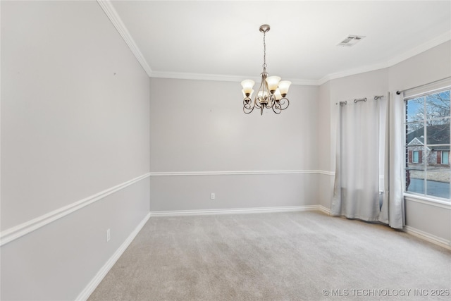 empty room with crown molding, carpet floors, and a notable chandelier