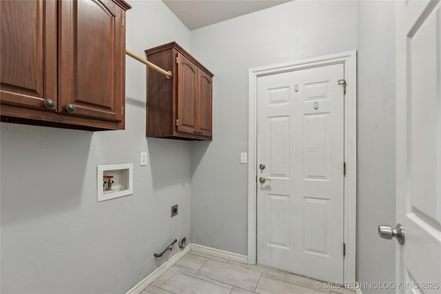 clothes washing area with cabinets, washer hookup, hookup for an electric dryer, and hookup for a gas dryer