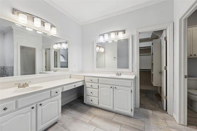 bathroom with vanity, ornamental molding, and toilet