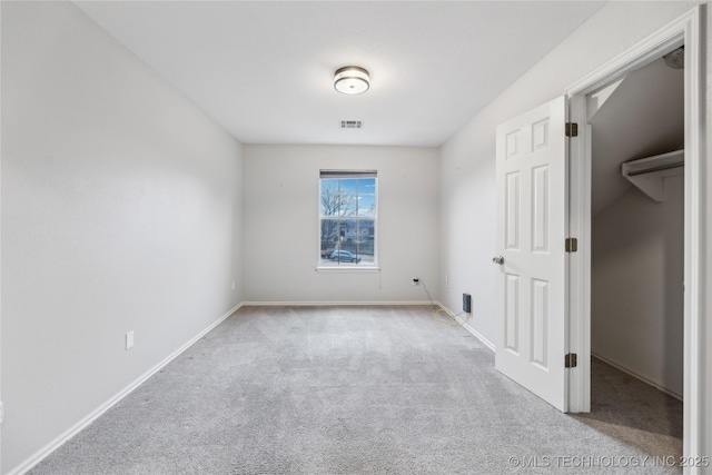 unfurnished bedroom with light colored carpet