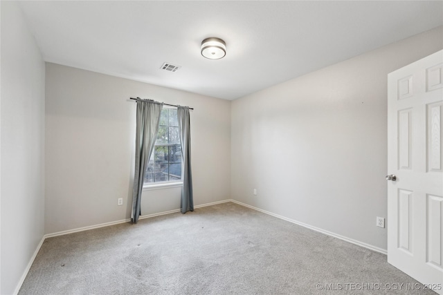 spare room with light colored carpet