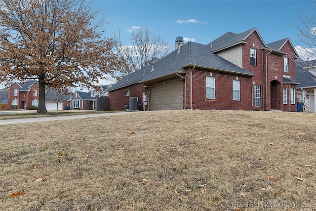 view of side of property featuring a yard and cooling unit