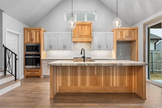 kitchen featuring oven, sink, and white cabinets