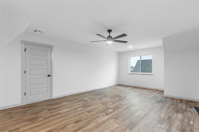 unfurnished room with ceiling fan and light wood-type flooring