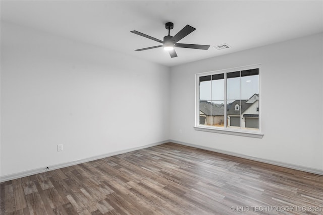 unfurnished room with hardwood / wood-style floors and ceiling fan