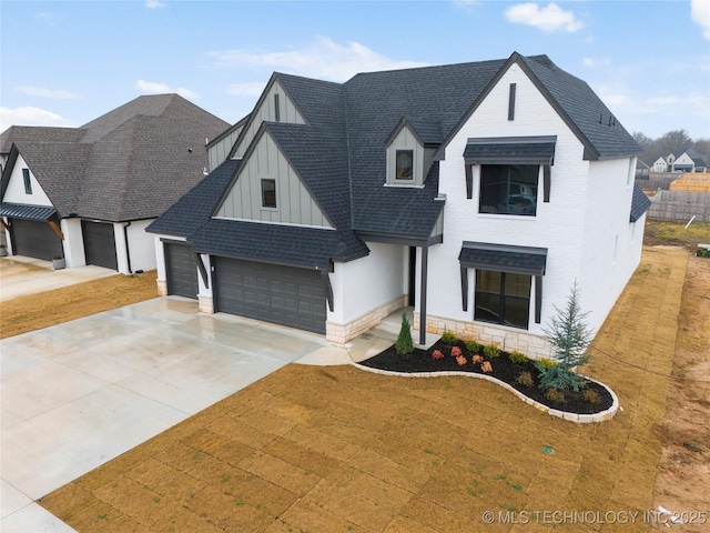 view of front of house with a garage and a front lawn