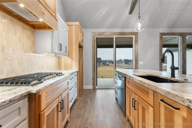 kitchen with premium range hood, sink, decorative light fixtures, appliances with stainless steel finishes, and decorative backsplash