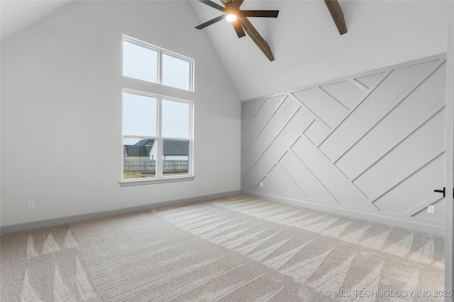 bonus room featuring ceiling fan, light colored carpet, and high vaulted ceiling