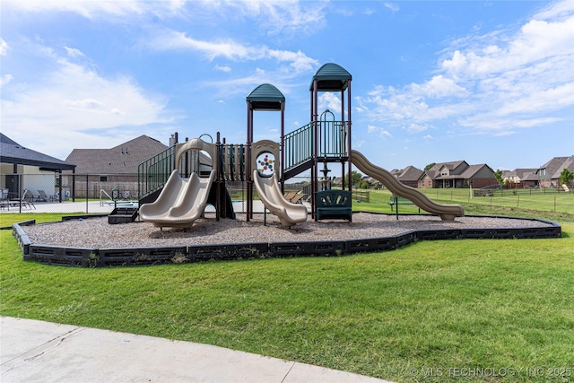 view of jungle gym featuring a lawn