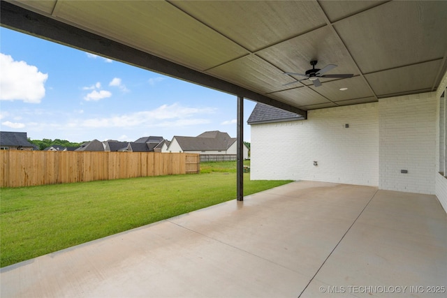 2078 E 136th Pl S, Bixby, OK 74008 - fenced backyard with a ceiling fan, a patio area, and a residential view