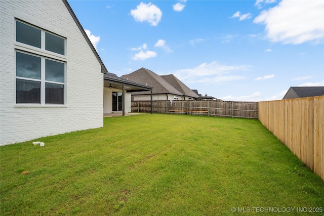 2078 E 136th Pl S, Bixby, OK 74008 - fenced backyard with a ceiling fan