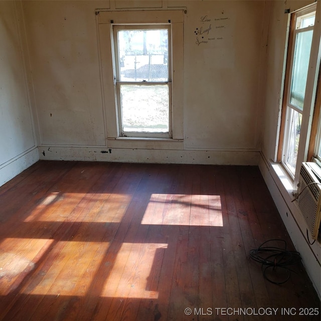 unfurnished room with dark hardwood / wood-style floors