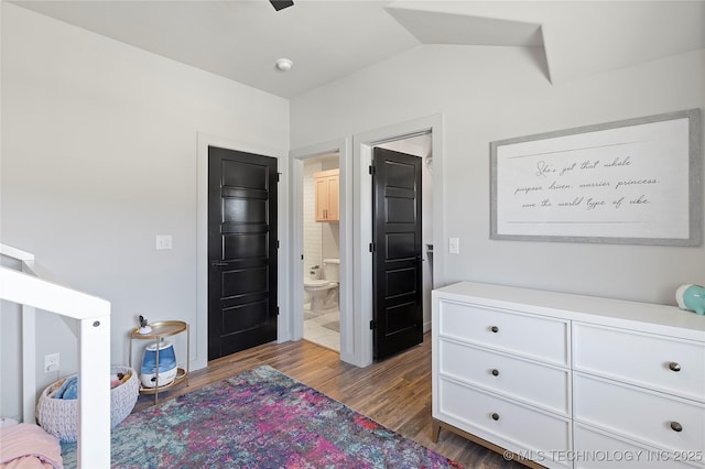 3748 E 116th St S, Tulsa, OK 74137 - bedroom with dark wood-style flooring, lofted ceiling, and connected bathroom