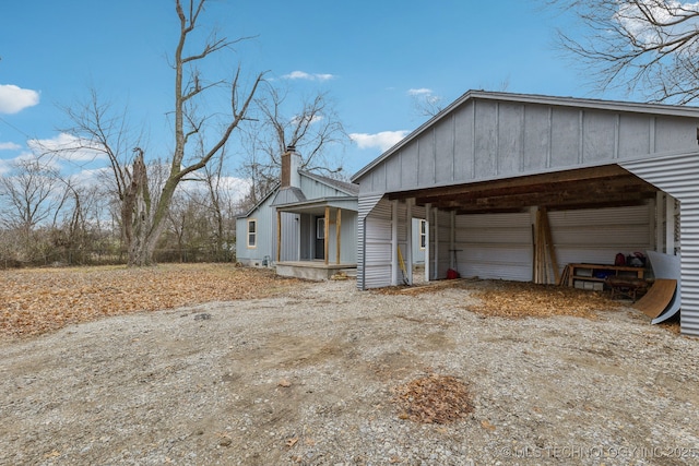 view of side of home with an outbuilding