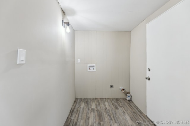 laundry room featuring washer hookup, hookup for an electric dryer, and light hardwood / wood-style flooring