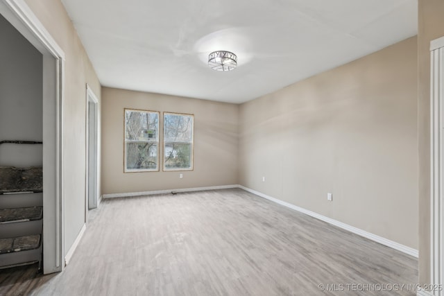 unfurnished room with light hardwood / wood-style floors