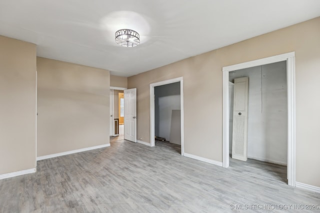 unfurnished bedroom featuring light hardwood / wood-style flooring