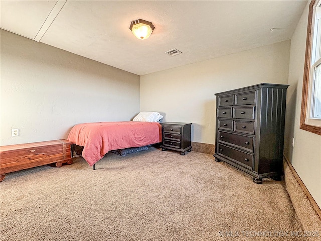 bedroom with light carpet