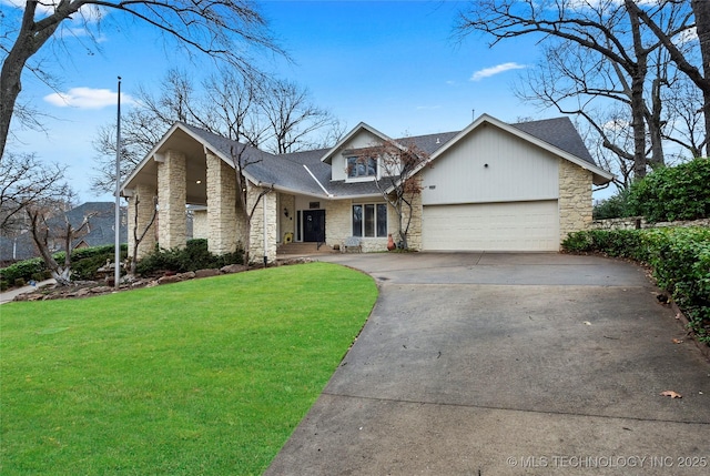 view of front of house with a garage and a front lawn