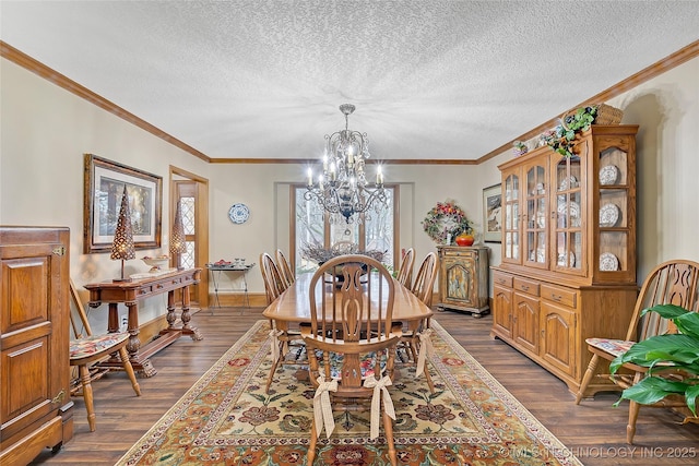 dining room featuring an inviting chandelier, crown molding, and dark wood-type flooring