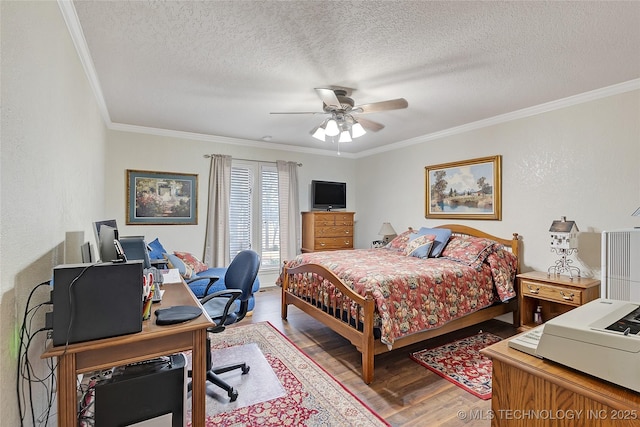 bedroom featuring crown molding, ceiling fan, hardwood / wood-style floors, and a textured ceiling