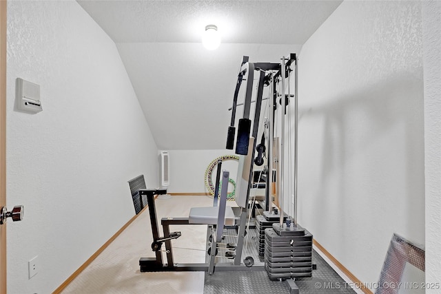 exercise room with a textured ceiling