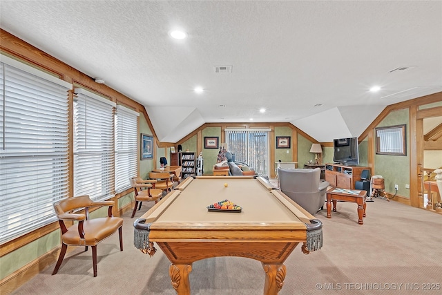 recreation room with billiards, vaulted ceiling, light colored carpet, and a textured ceiling