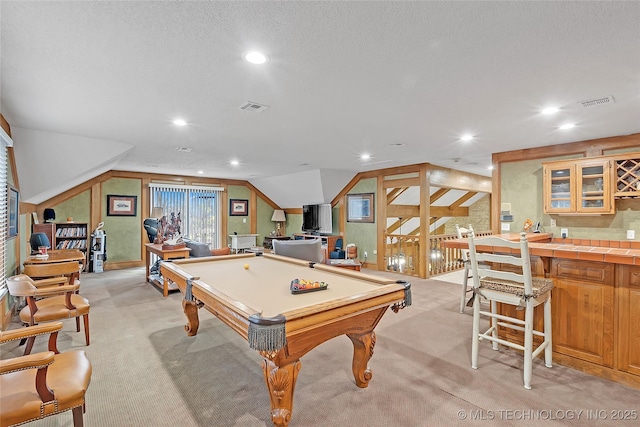 recreation room featuring lofted ceiling, light colored carpet, a textured ceiling, and billiards