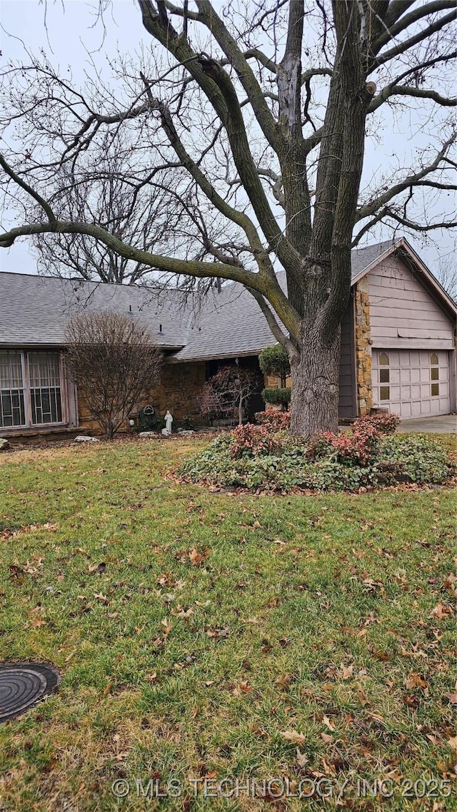 view of yard featuring a garage